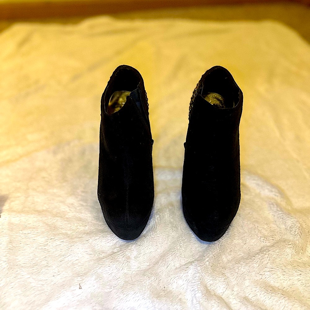 Forever 21, Black high heeled boots with brass rivets on the back of each boot.